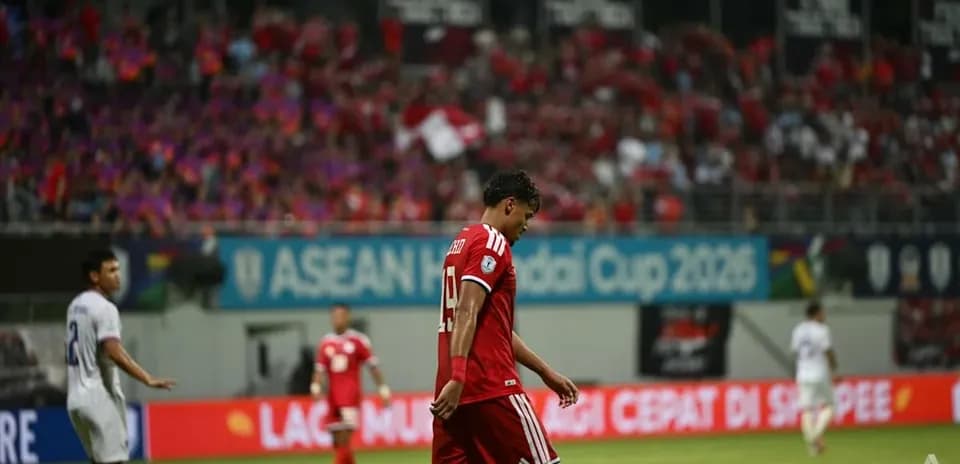 Player walking off field during football match