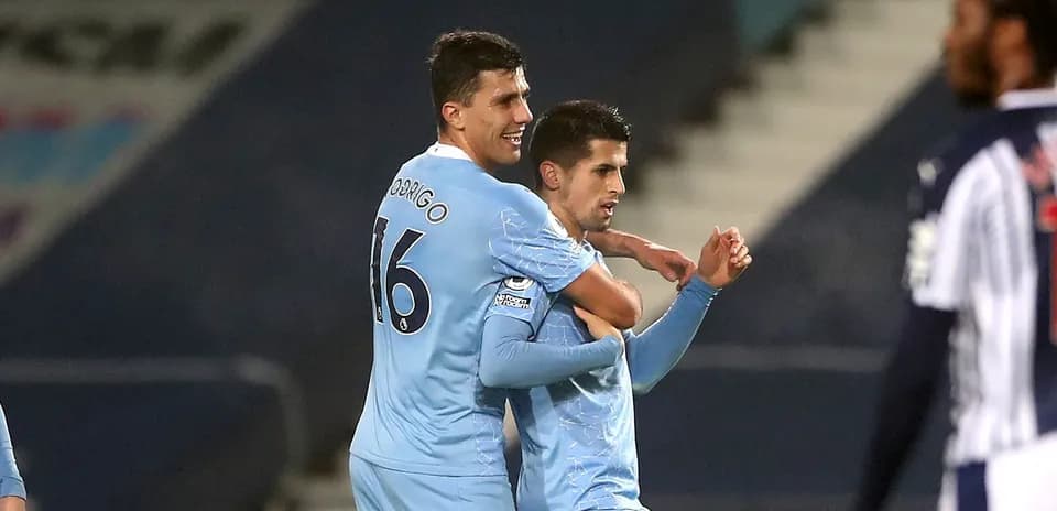 Two players celebrating a goal during match