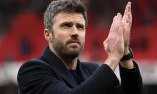 Man applauding in a stadium with red background