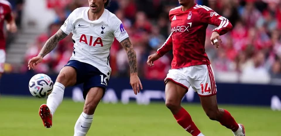 Tottenham player kicking the ball against Nottingham