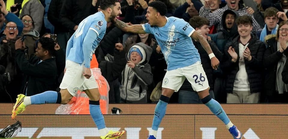 Manchester City players celebrating a goal
