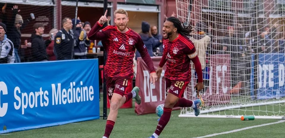 Players celebrating a goal during USL match