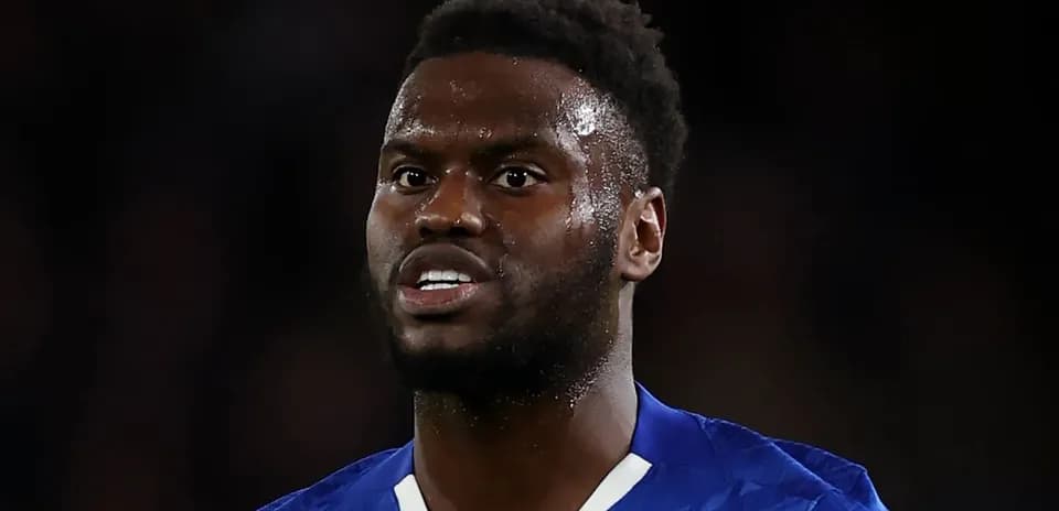Player in blue kit during a match close-up