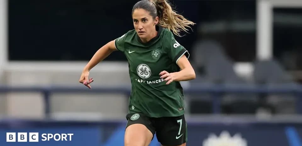 Player in green kit running during a match