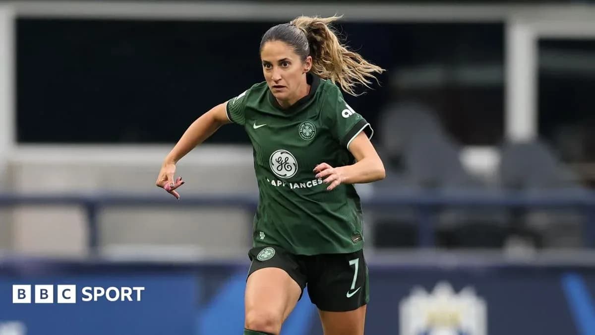 Player in green kit running during a match