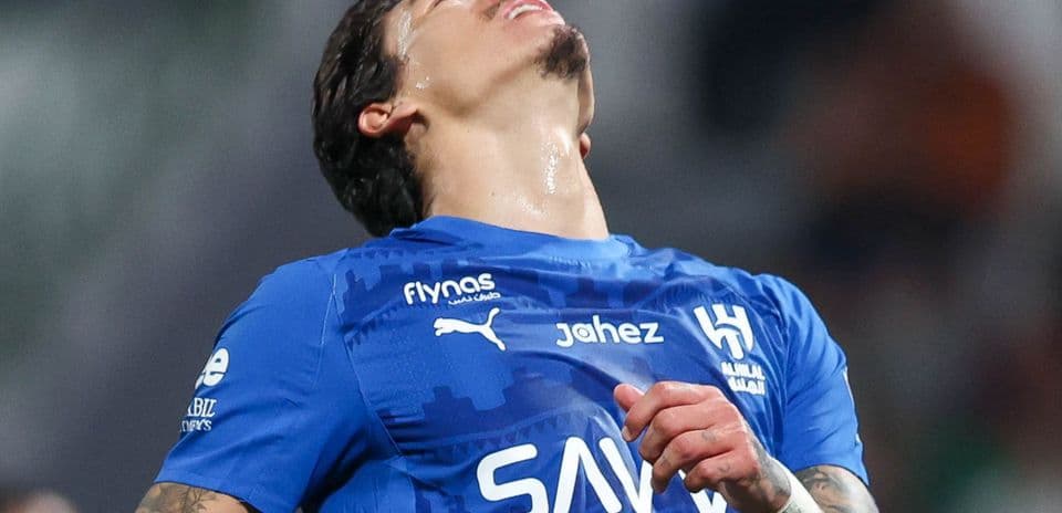 Player in blue jersey reacting on the field