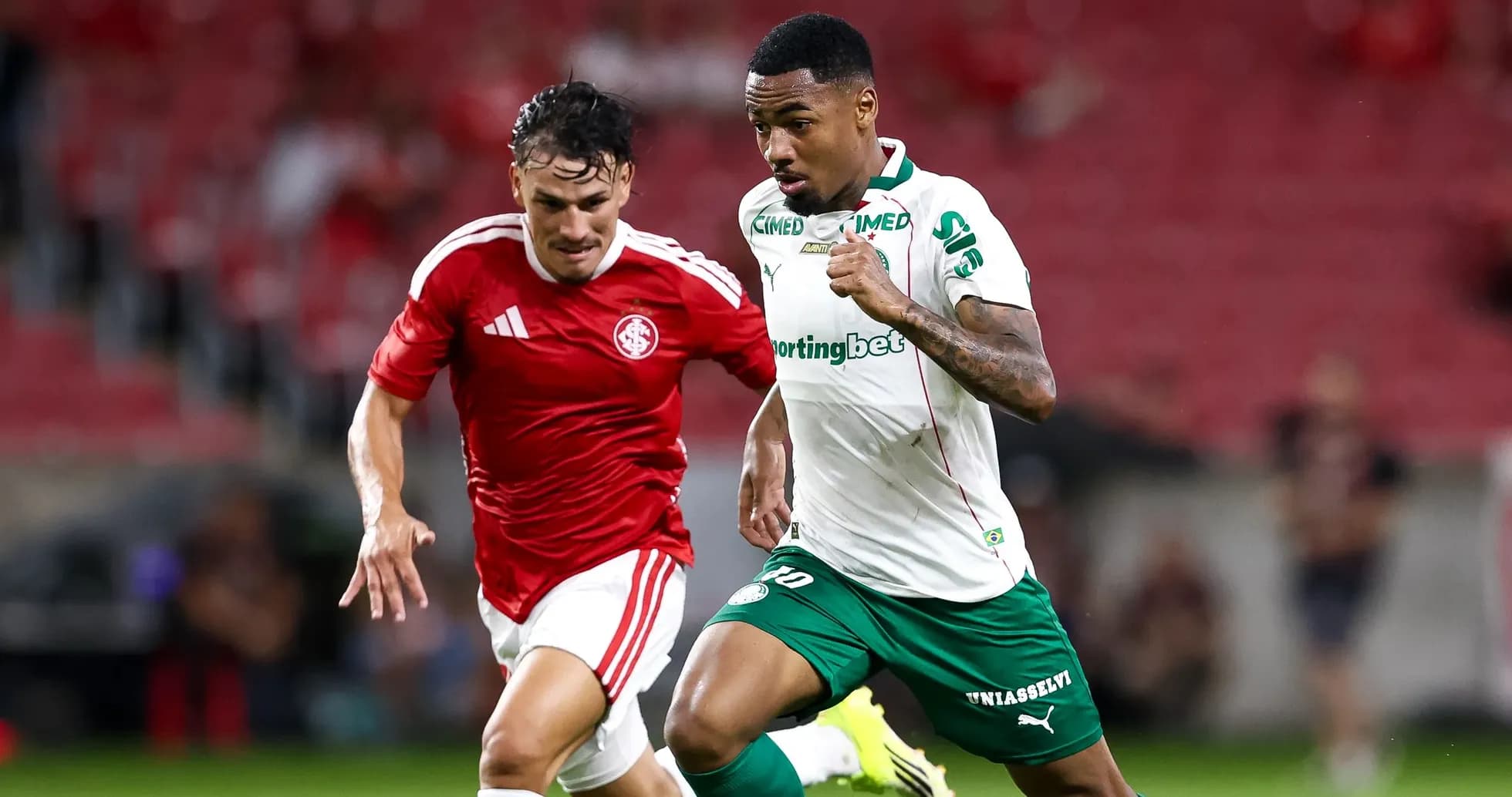 Two players sprinting during a football match