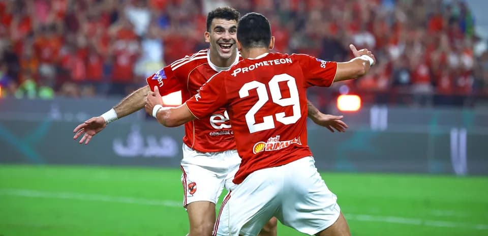 Players celebrating a goal during a football match