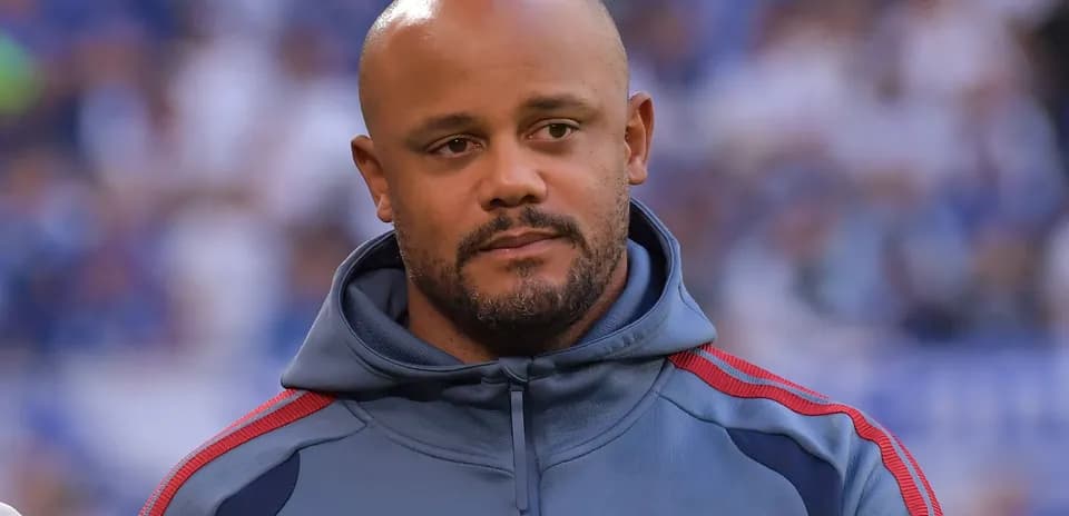 Man wearing a gray hoodie with red accents