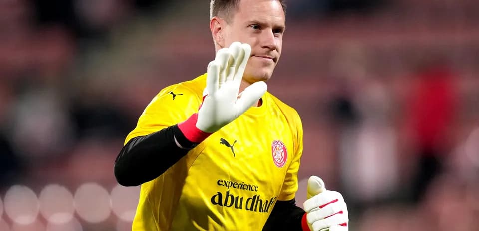 Goalkeeper waving in yellow jersey during warm-up
