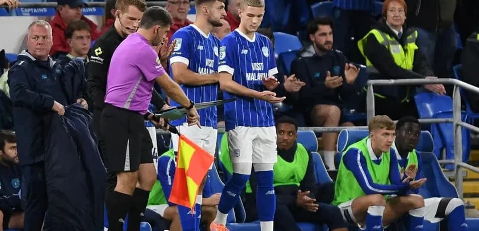 Player being substituted during football match