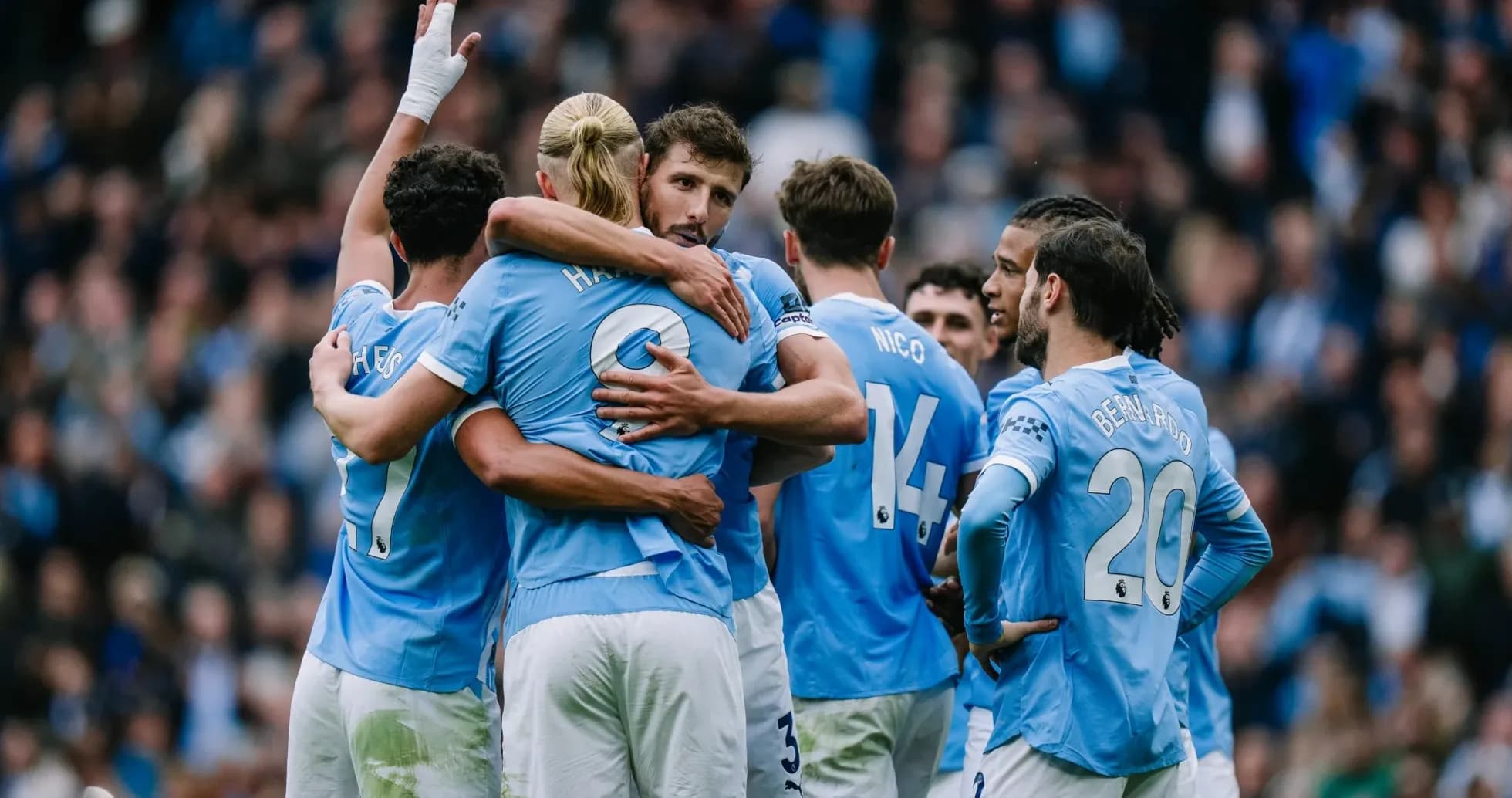 Manchester City players celebrating a goal