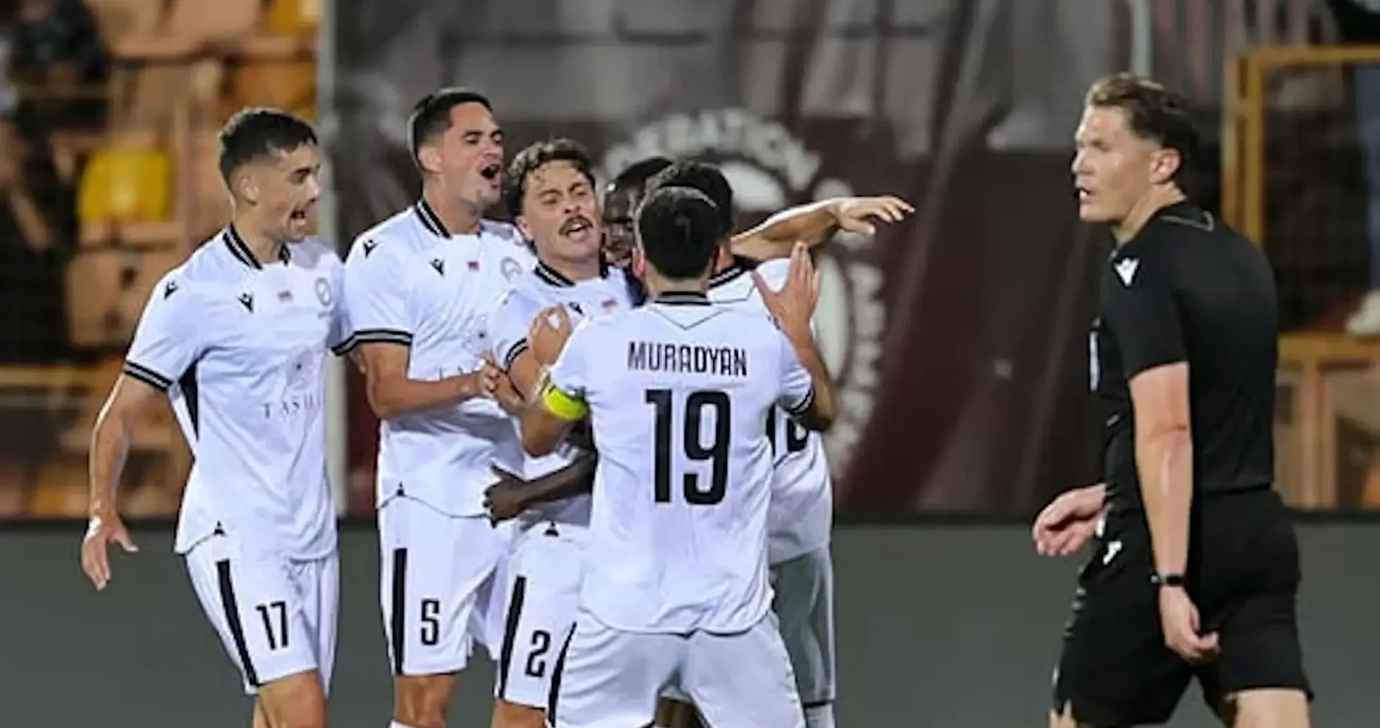 Players celebrating a goal during UEFA match