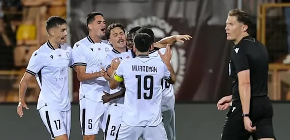 Players celebrating a goal during UEFA match