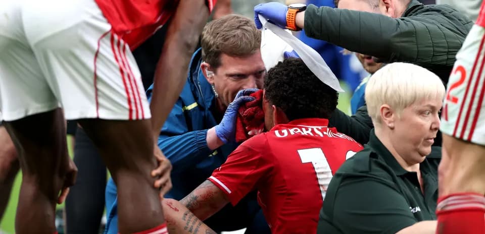 Medical staff attending to injured player on field