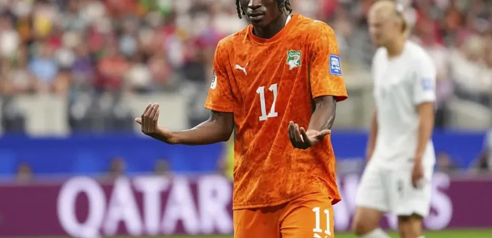 Ivorian player gesturing during a soccer match