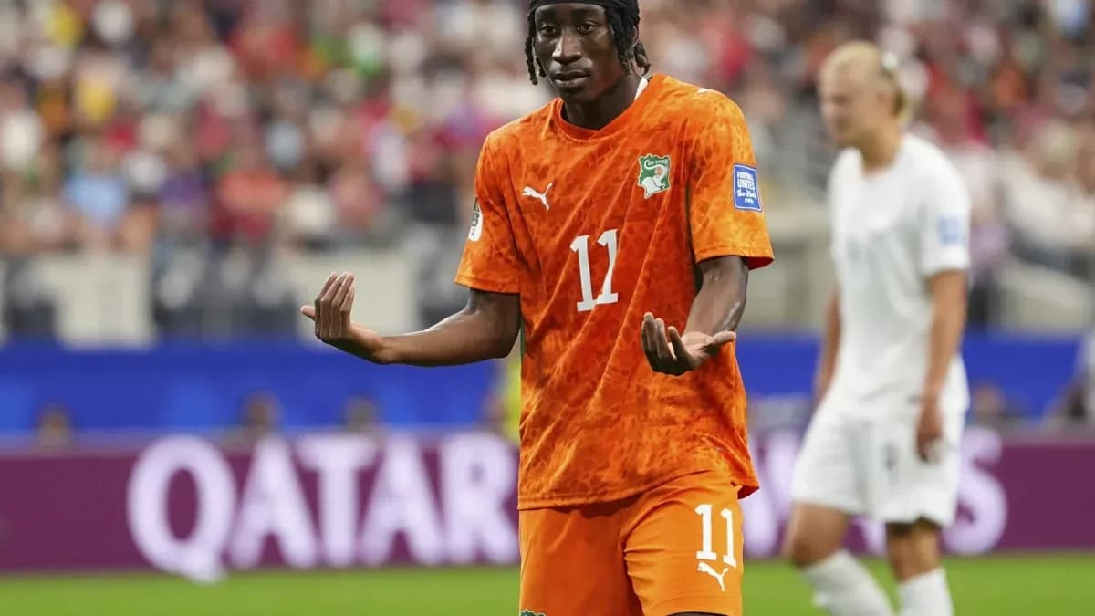 Ivorian player gesturing during a soccer match