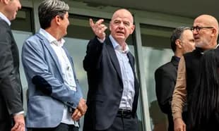 Group of officials discussing at a VIP area