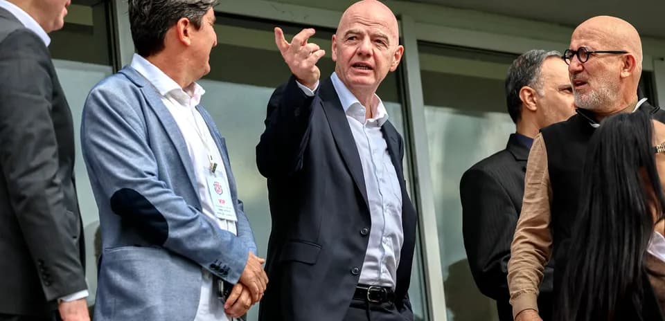 Group of officials discussing at a VIP area