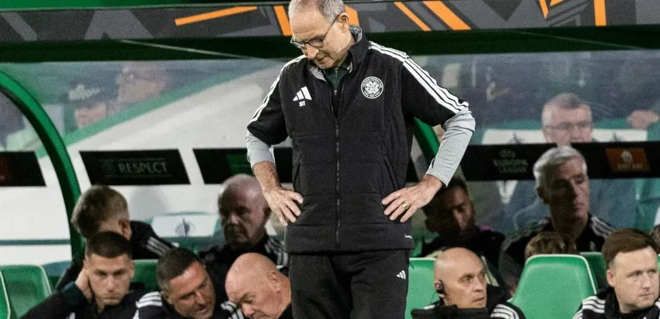 Coach looking down on bench during match