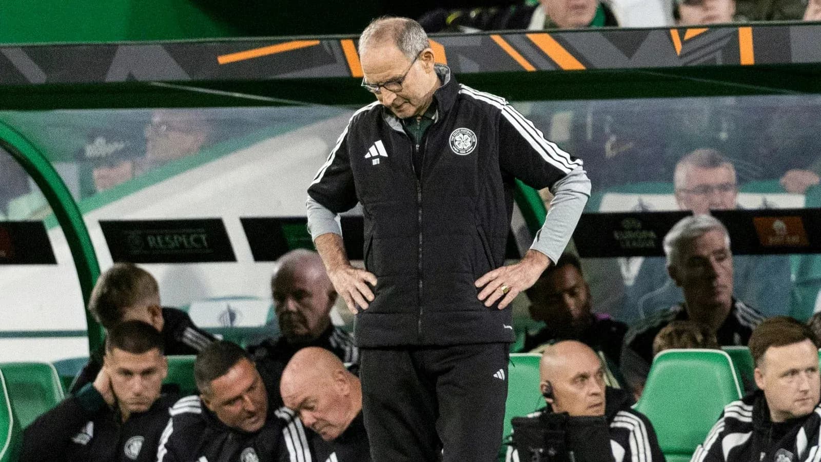 Coach looking down on bench during match