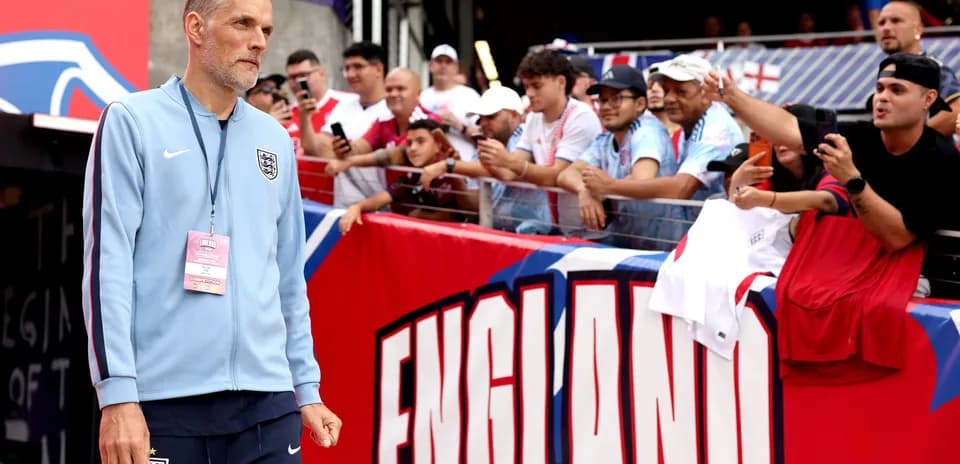 Coach walking towards fans before the match