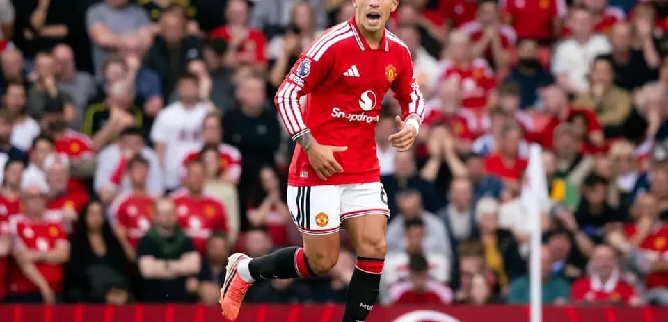 Player celebrating during match at Old Trafford