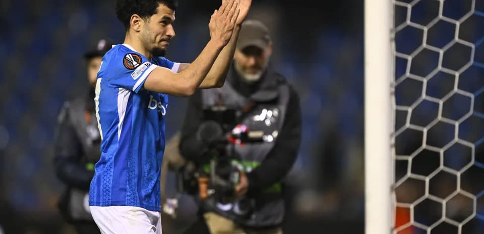 Player applauding fans after the match