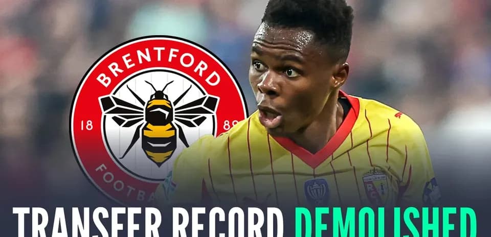 Player celebrating with Brentford logo background