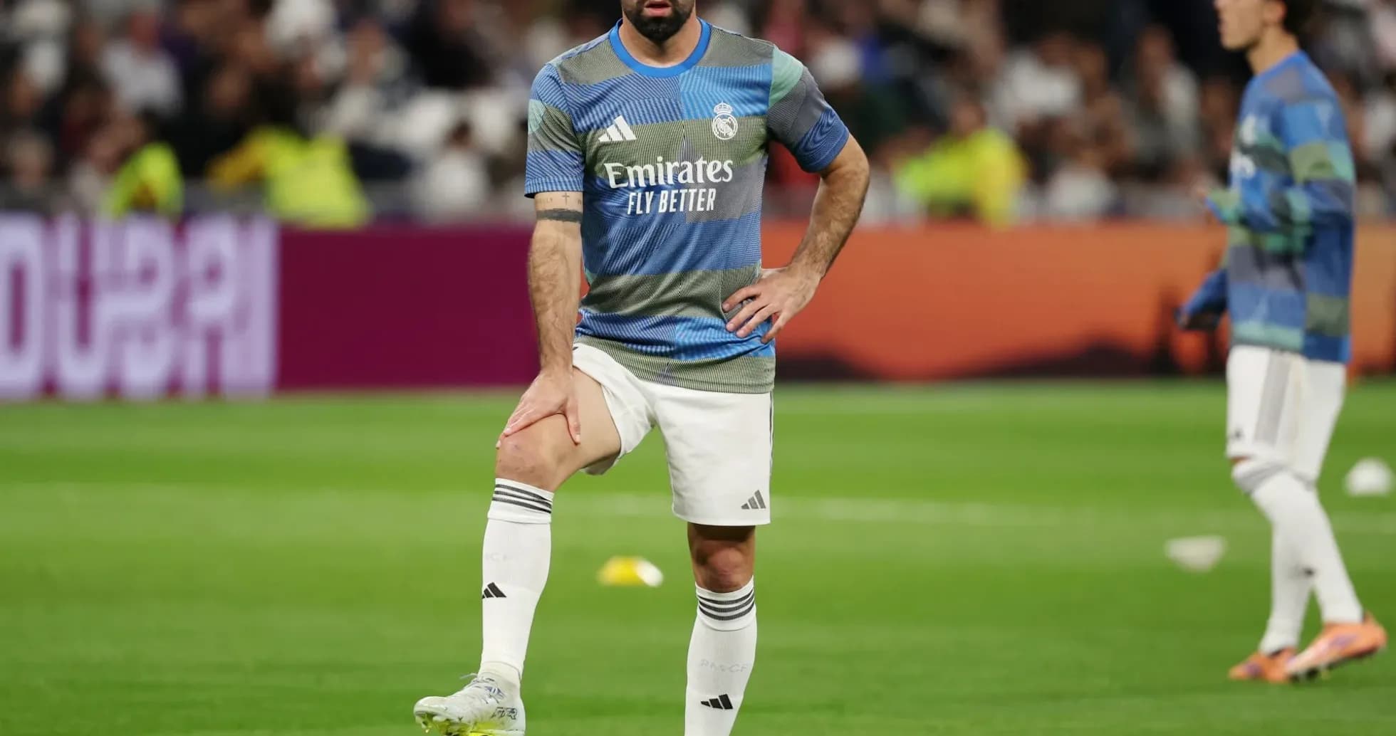 Player warming up on the pitch before match