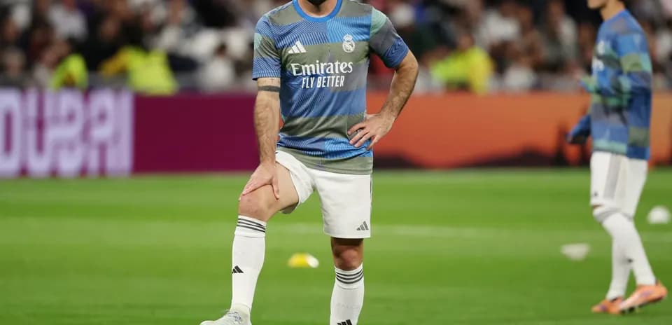 Player warming up on the pitch before match