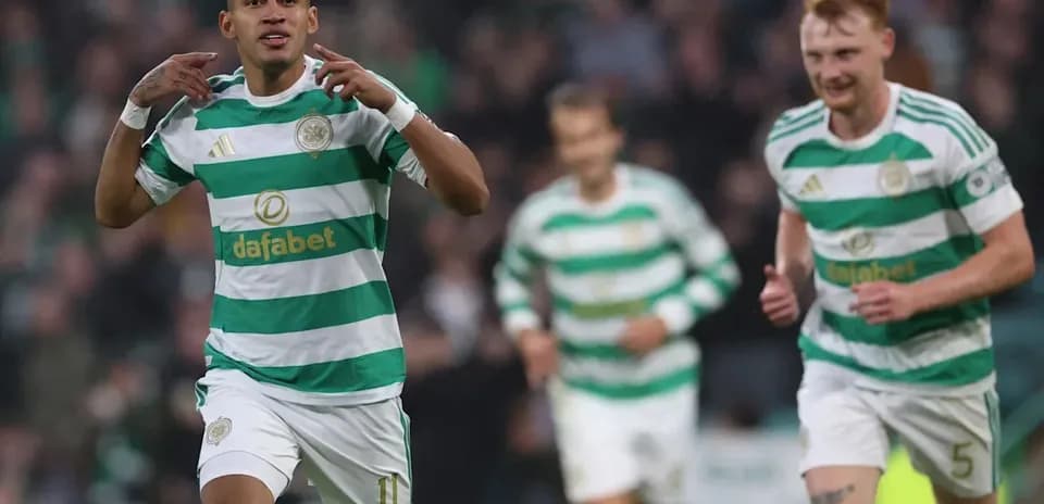 Celtic player celebrating a goal with teammates