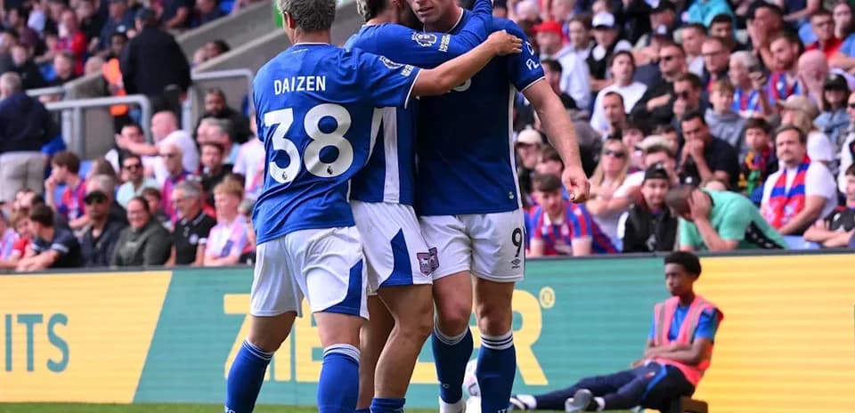 Players celebrating a goal during match