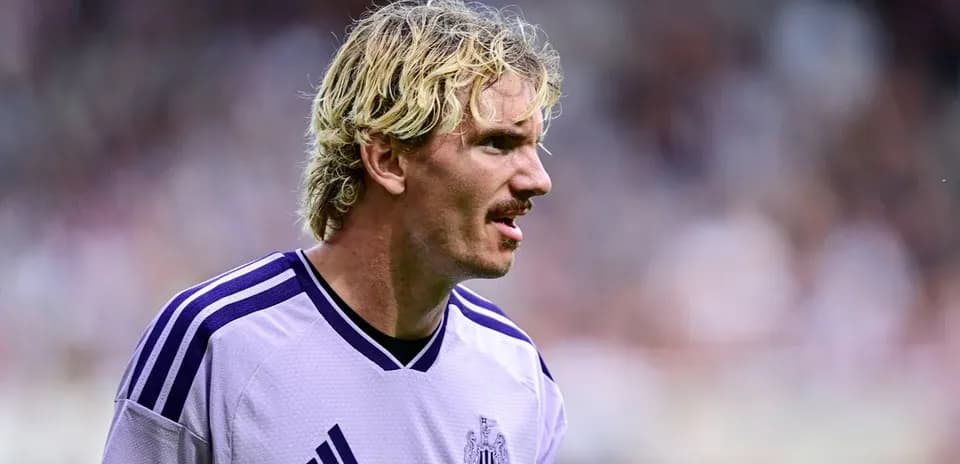 Newcastle player in purple kit during match