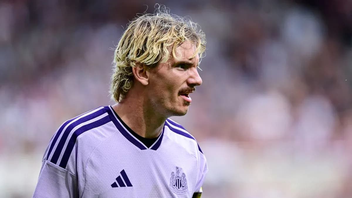 Newcastle player in purple kit during match
