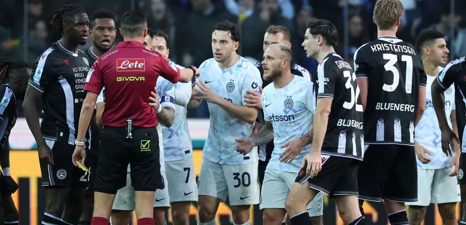 Inter players discussing with referee during match