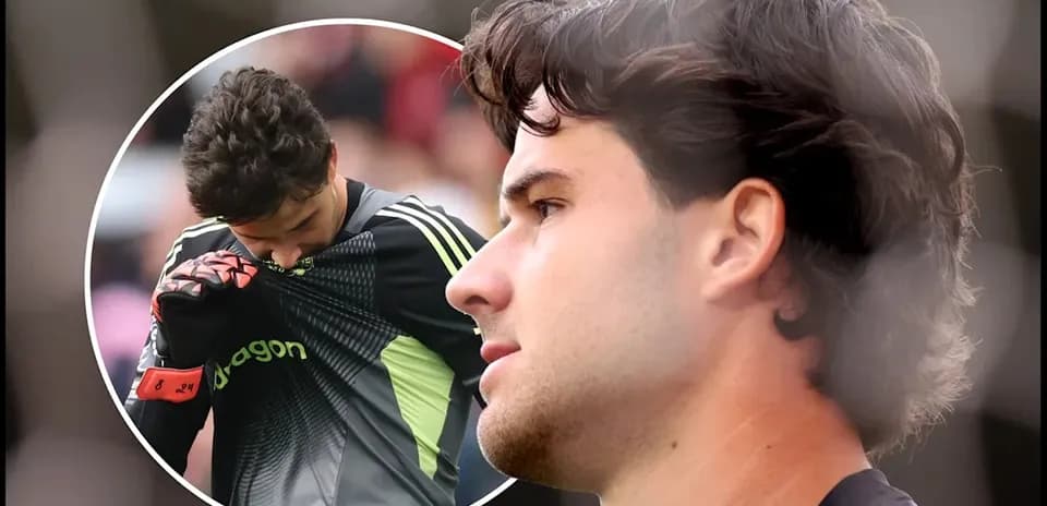 Goalkeeper adjusting jersey during match action