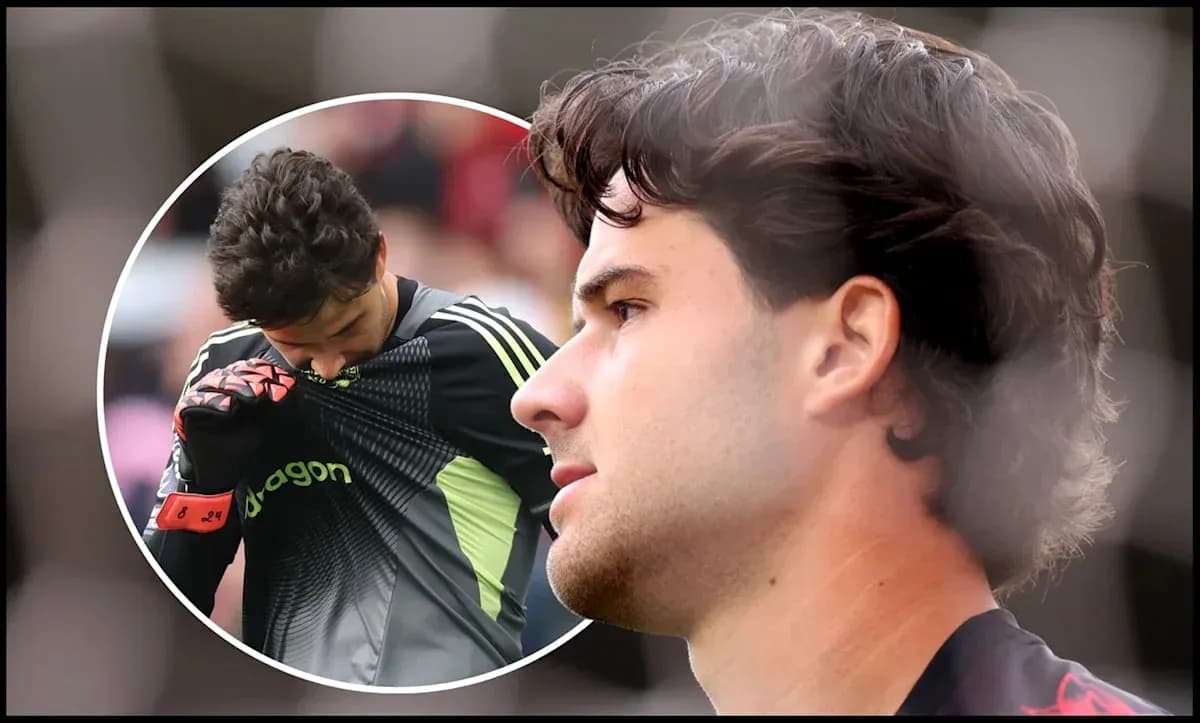 Goalkeeper adjusting jersey during match action