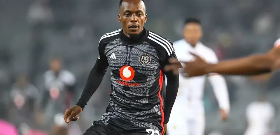 Player in black jersey running on the field