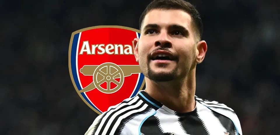Newcastle player with Arsenal logo in background