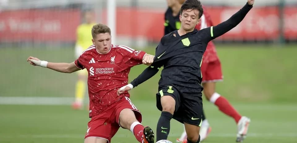 Two players battling for the ball during match