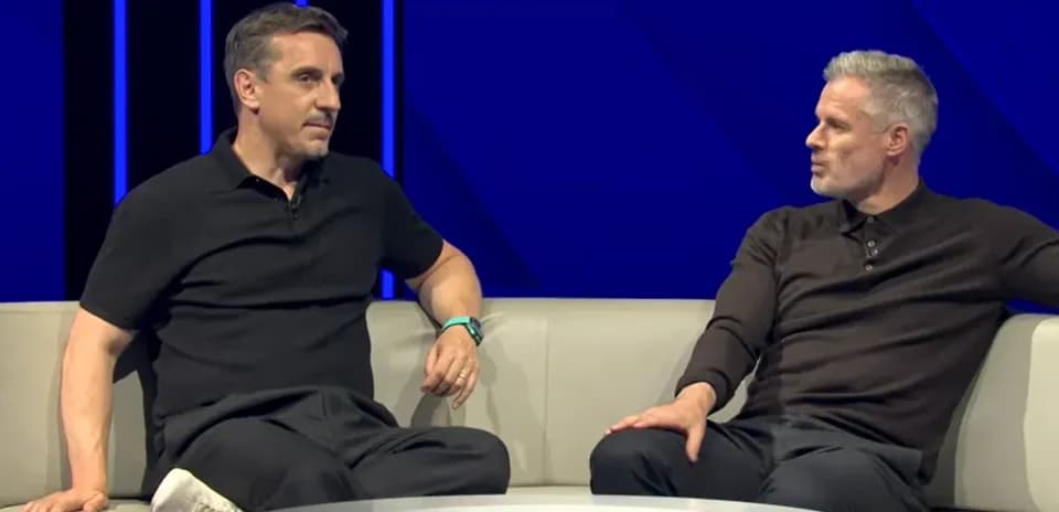 Two analysts discussing on a studio sofa