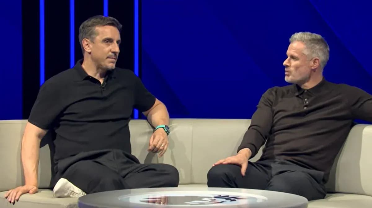 Two analysts discussing on a studio sofa