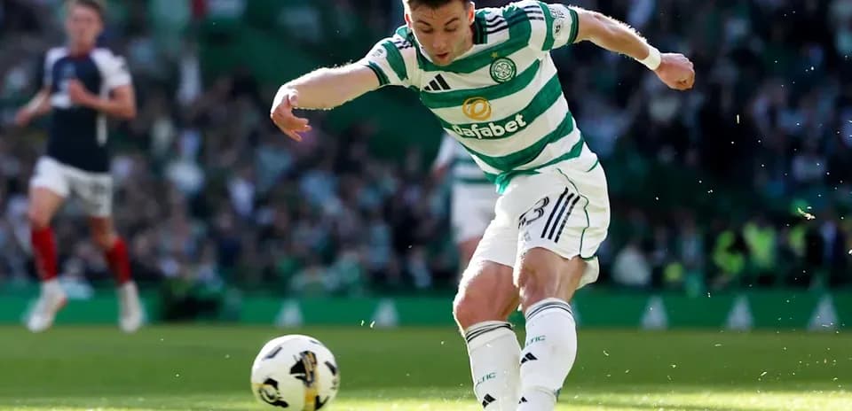 Celtic player kicking ball during match