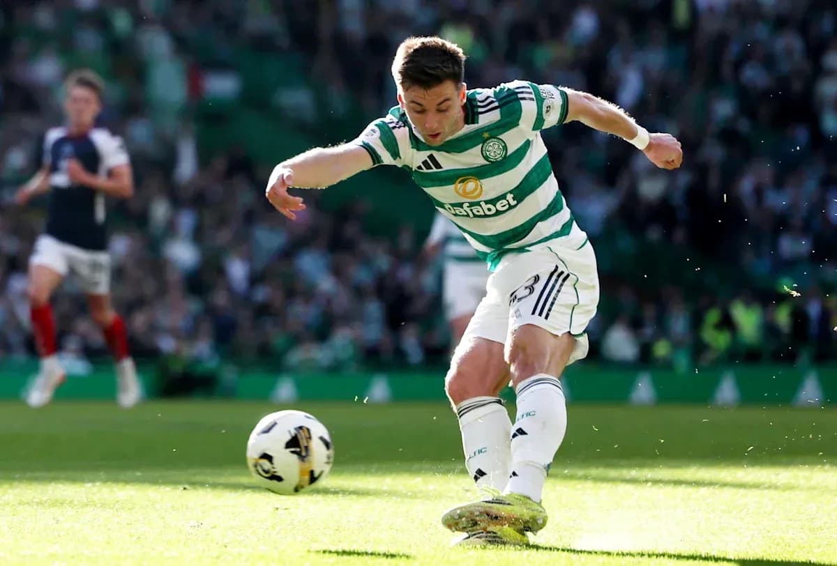 Celtic player kicking ball during match