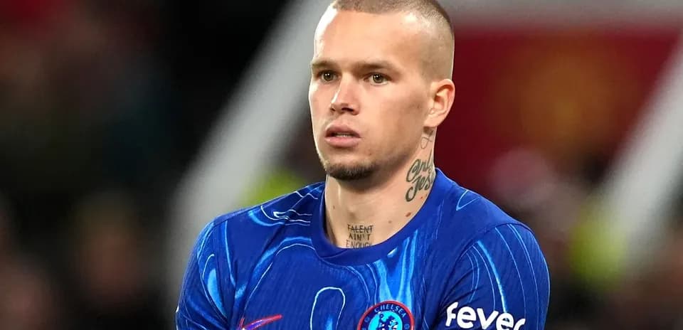 Player wearing Chelsea kit during match preparation