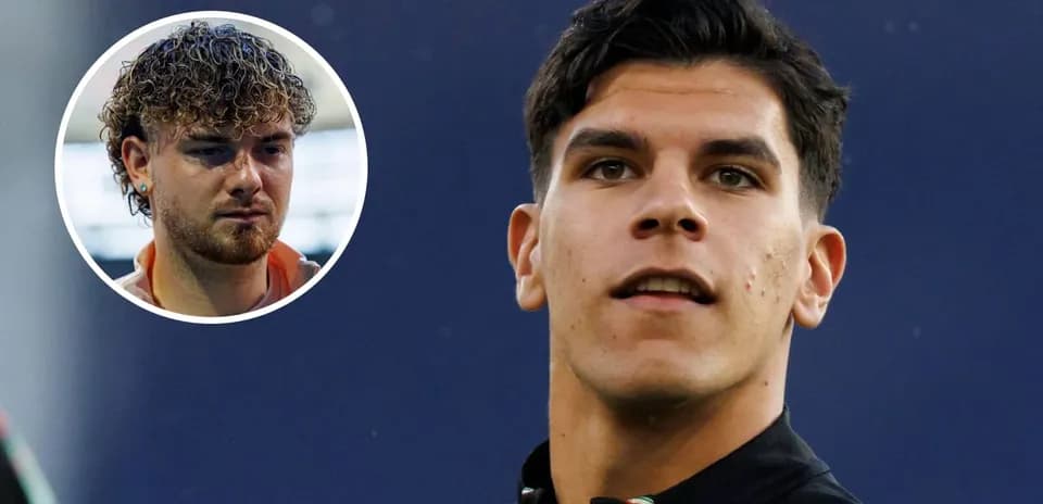 Two soccer players, one in close-up and one in background