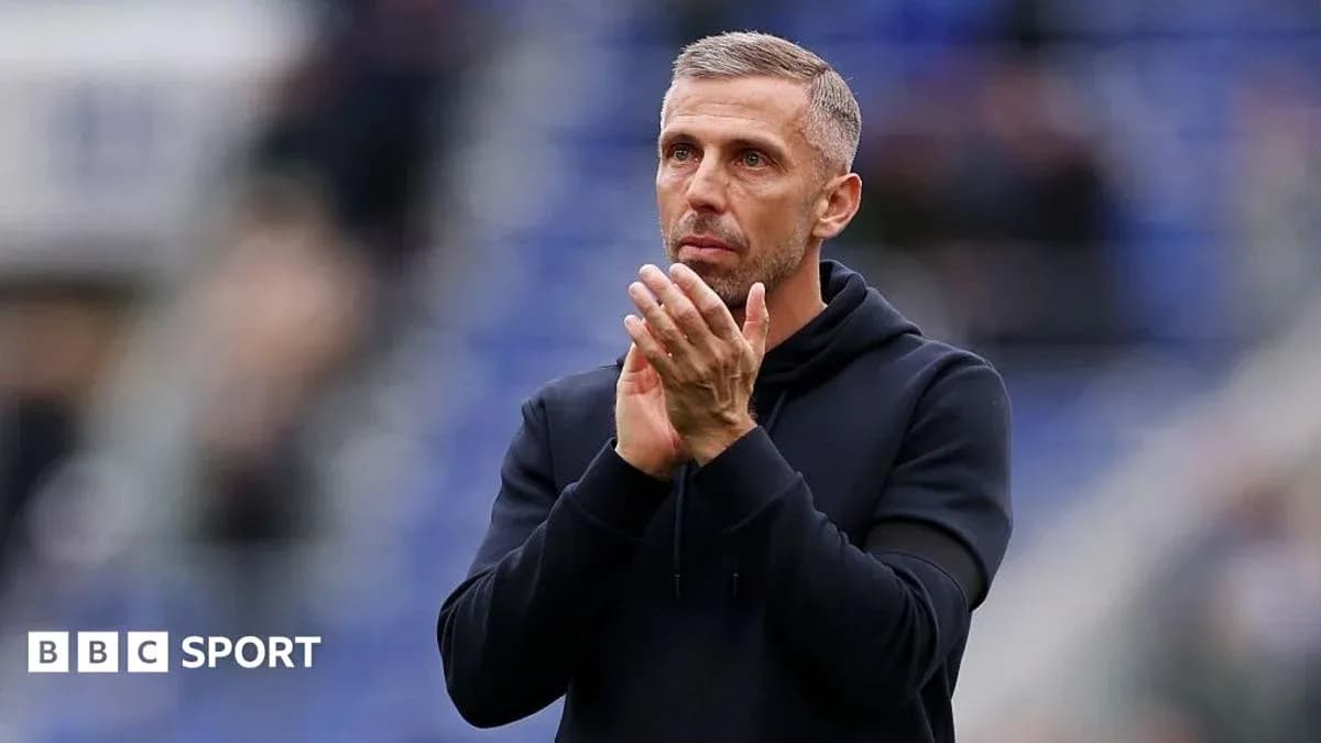 Coach applauding fans after the match