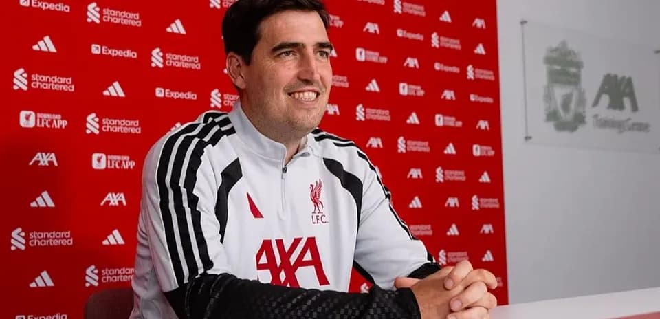 Coach at press conference in Liverpool training center
