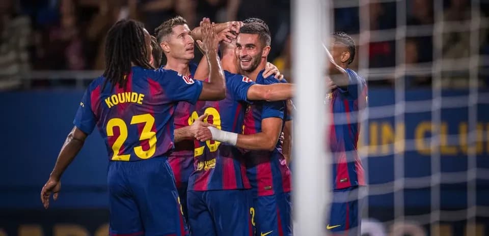 Barcelona players celebrating a goal during match